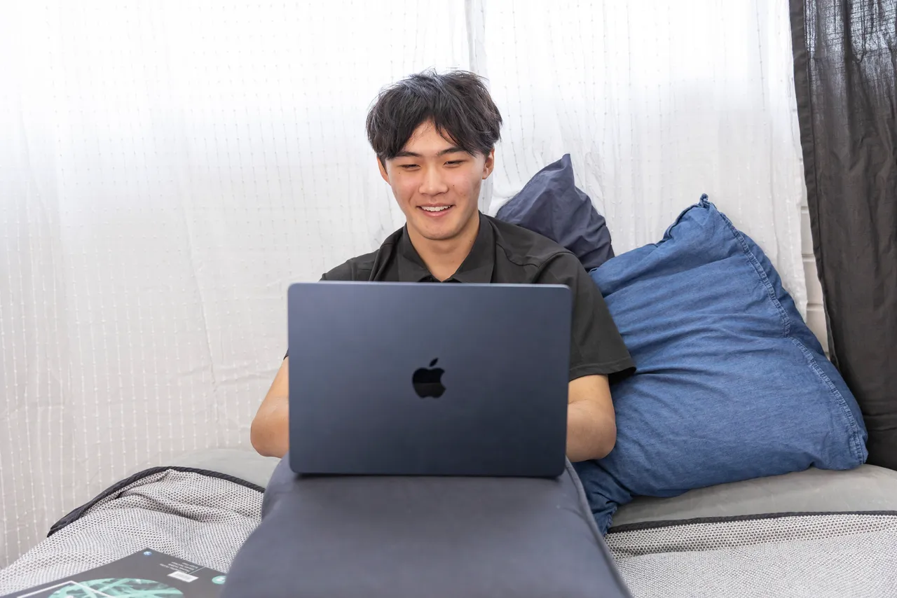 A focused student completing structured high school coursework on a computer from home.
