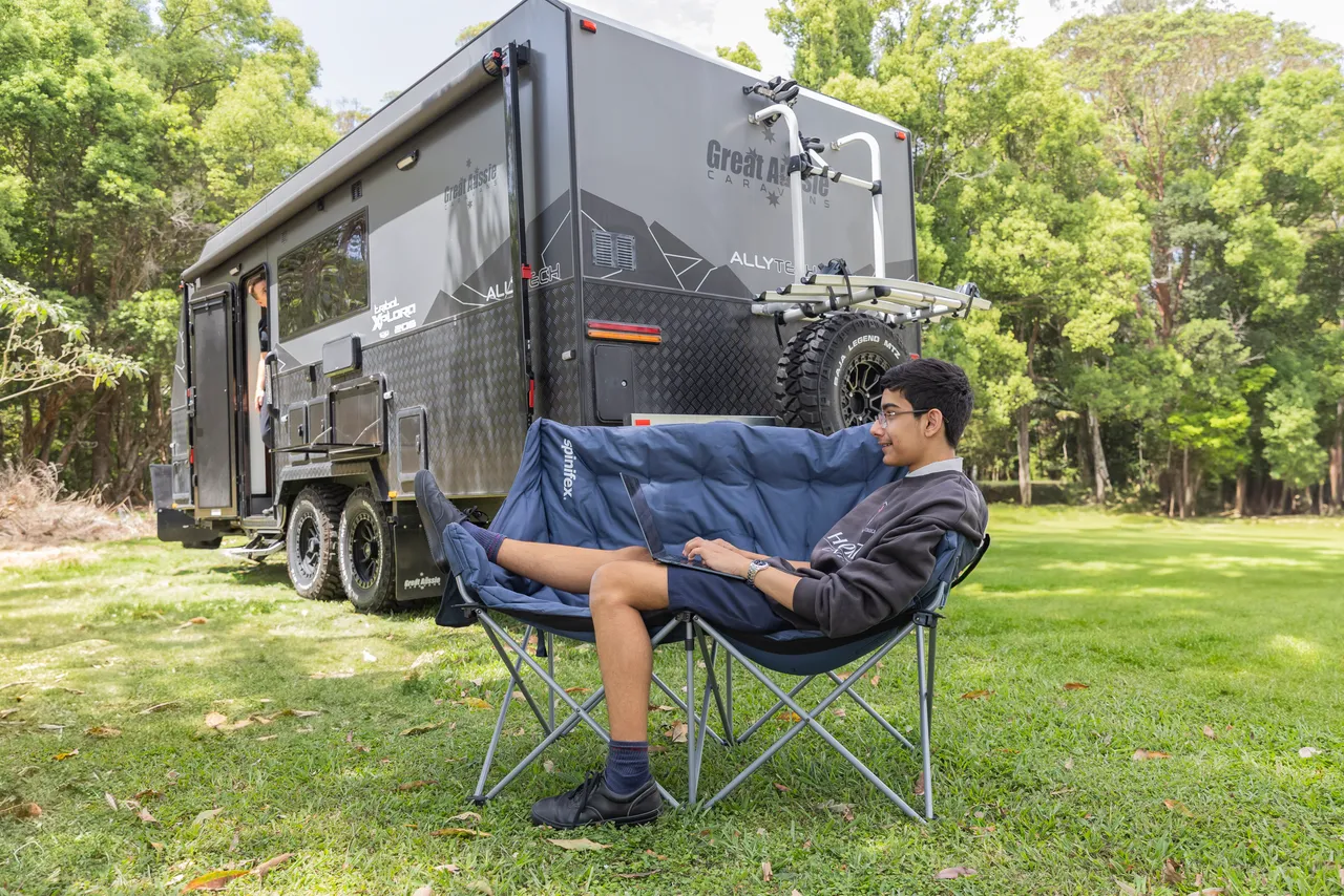 Homeschooled student accessing online lessons and educational resources while travelling.