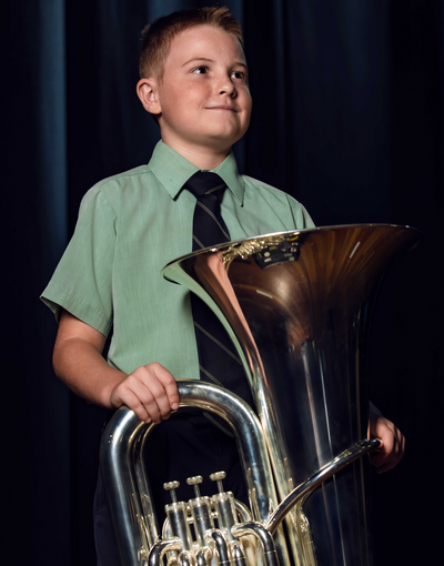 Young student holding Trombone