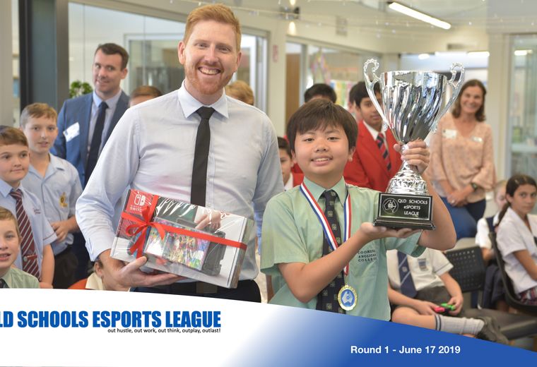 Student winning award with group of teachers and other students