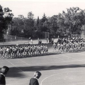 Marching on the tennis courts in 1976