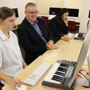 Students with teacher in the innovative music laboratory in 2016