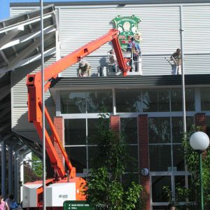 Installation of the new crest on the Senior School Hall in 2012