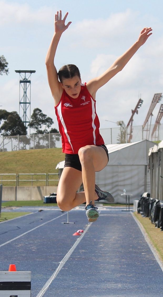 High school sport student in long jump.