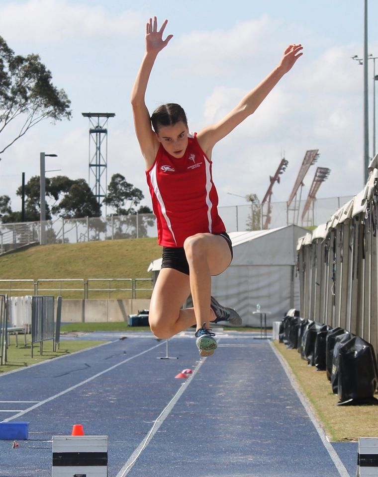 High school sport student in long jump.