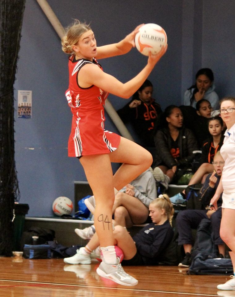 High school student playing sport.