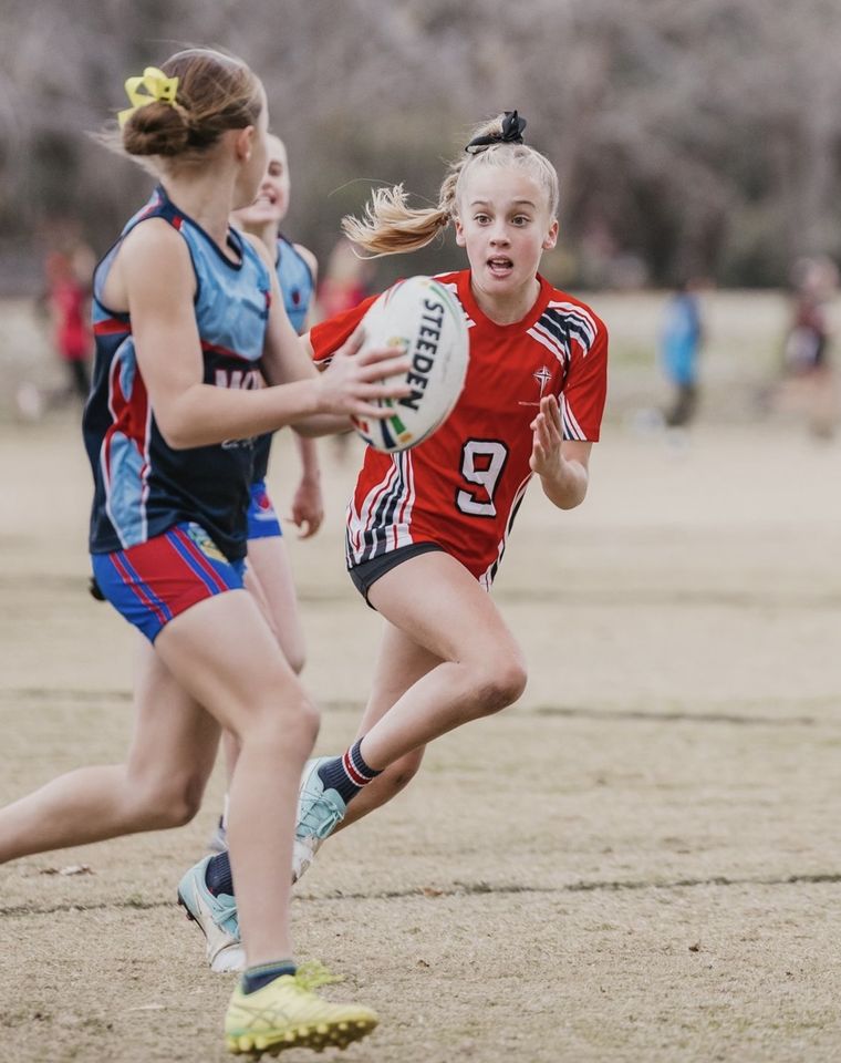 Primary school student playing sport