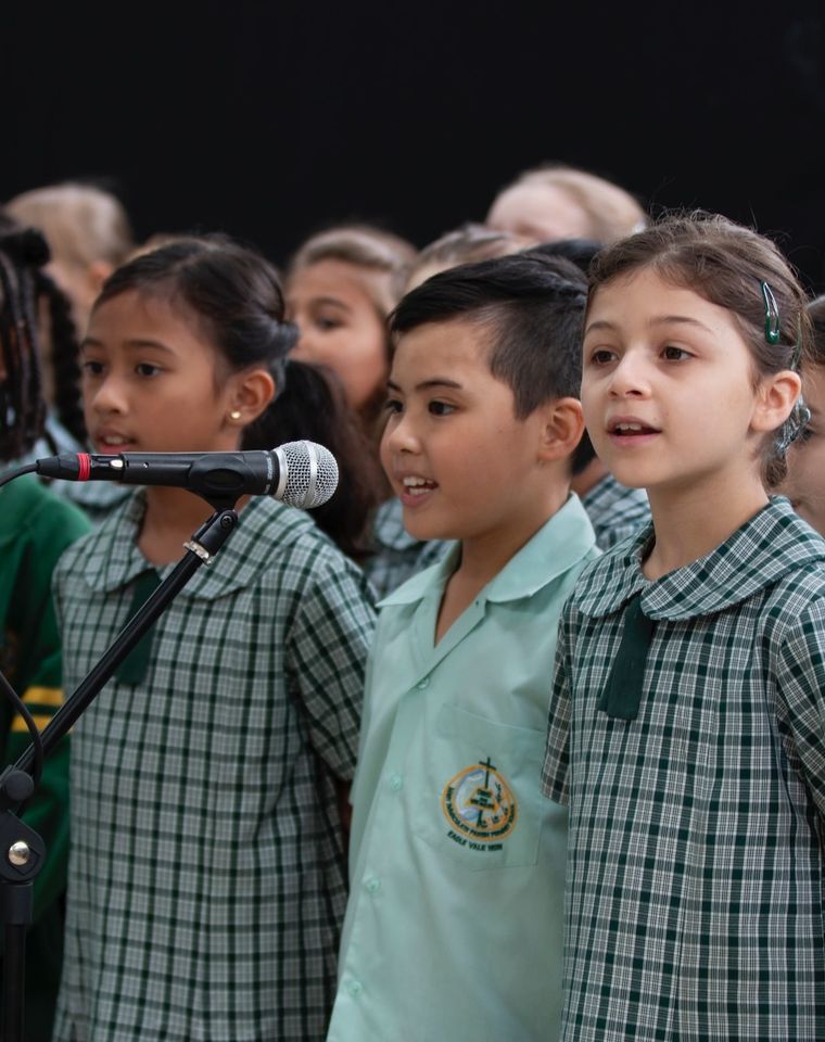 Primary school students singing in choir.