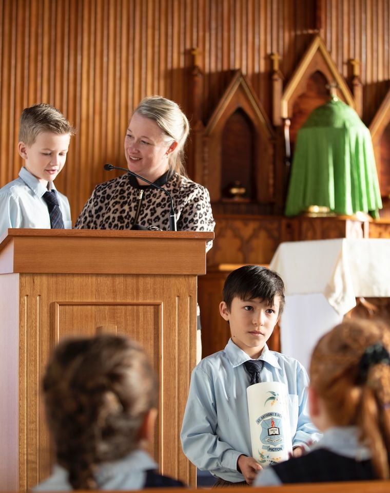 Primary school students with teacher at church.