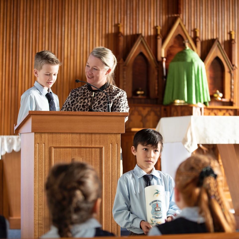 Primary school students with teacher at church.