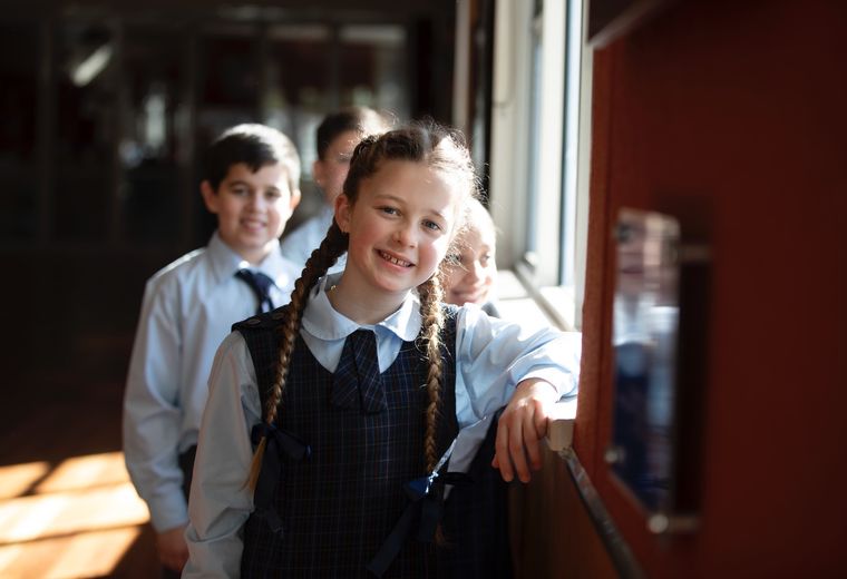 Primary school student smiling at camera.