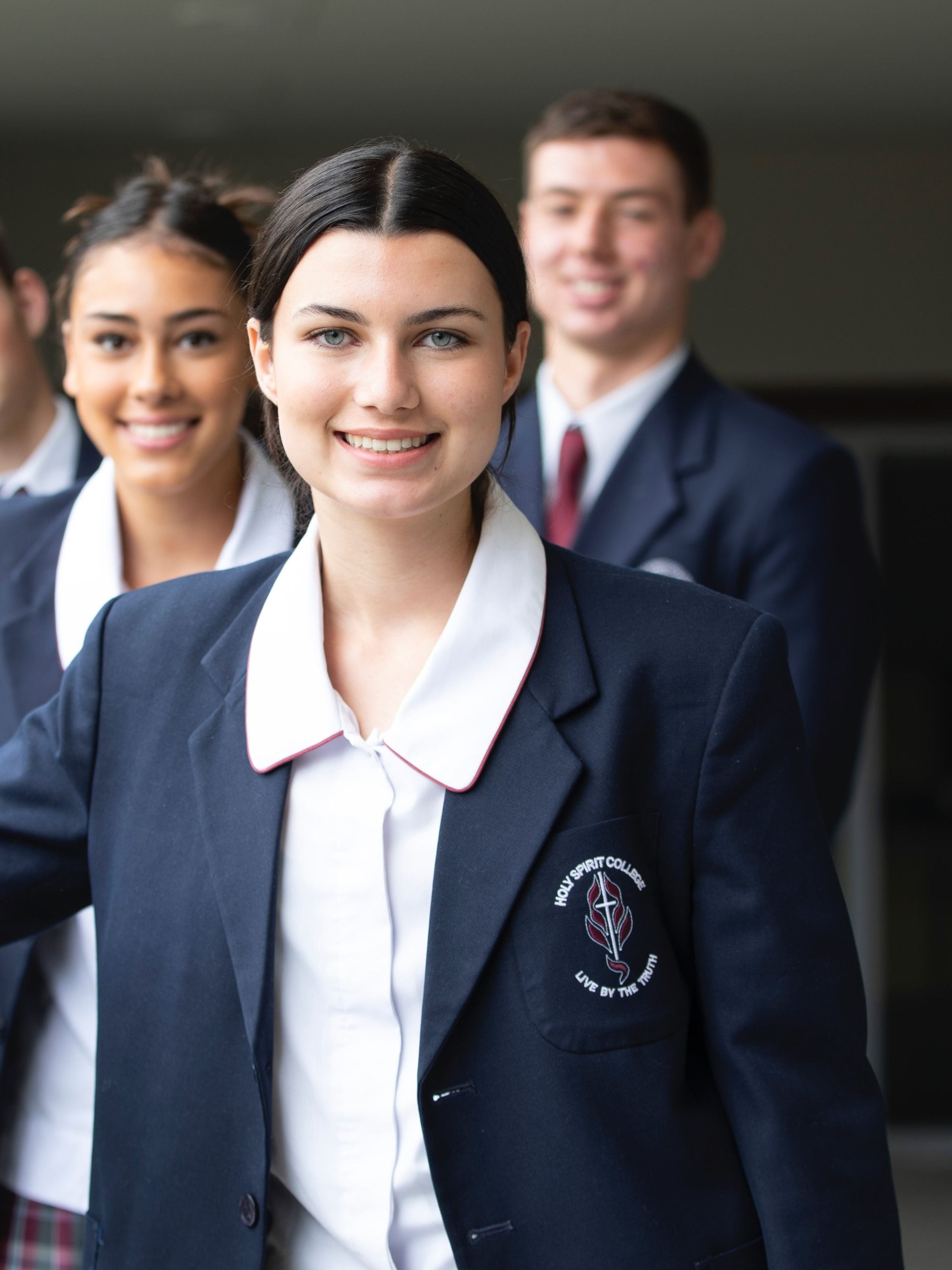 High school student smiling at camera.