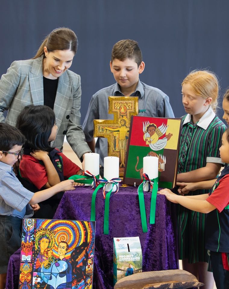 High school students with teacher with religious items.