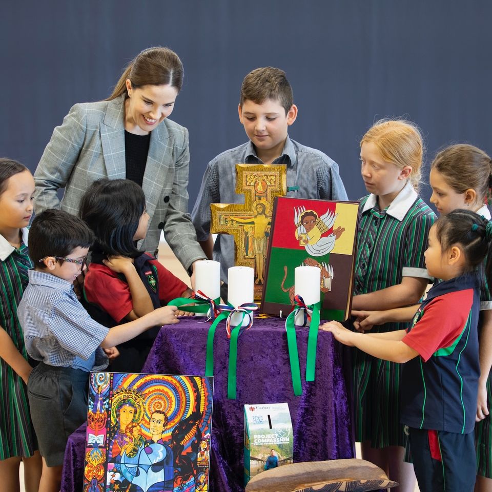 High school students with teacher with religious items.