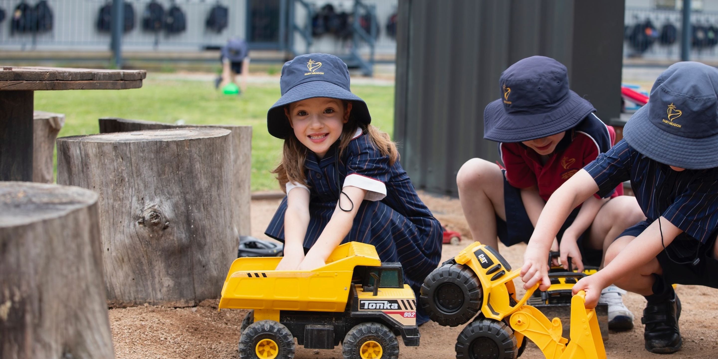 Primary school students playing in sandpit.