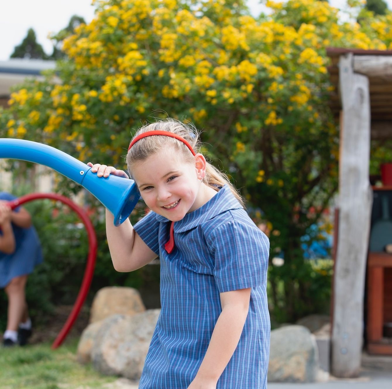 Primary school student playing in playground.