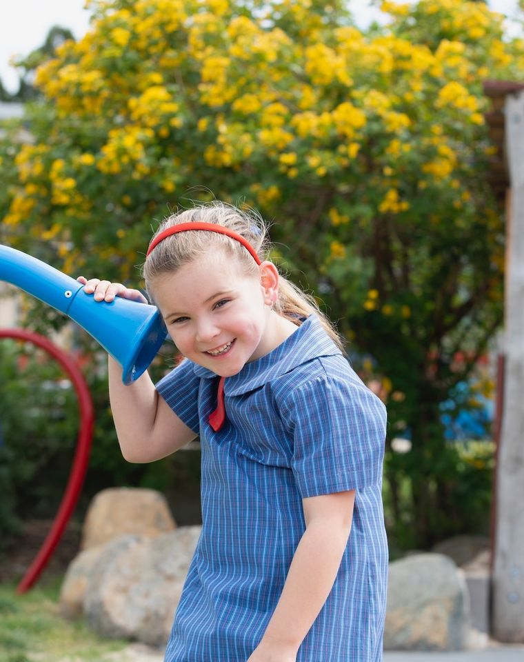 Primary school student playing in playground.