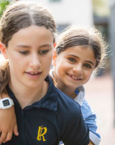 A Junior School student playing with a Senior School student at Ruyton Girls' School.