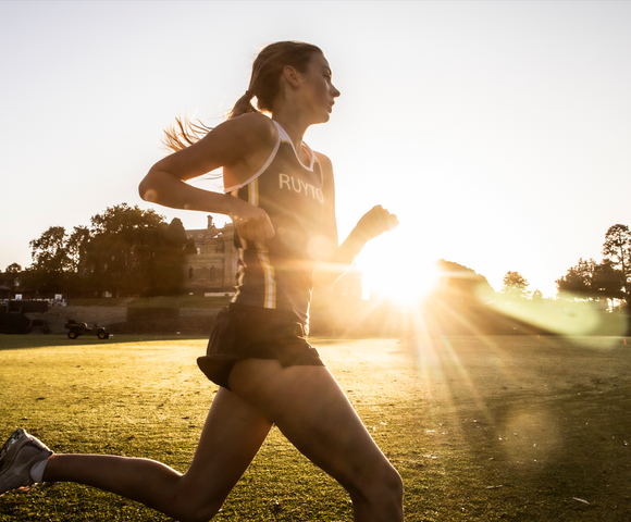 Ruyton student running around the Oval at sunrise.