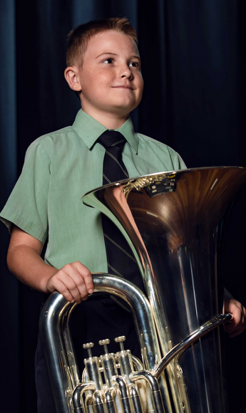 Young student holding Trombone