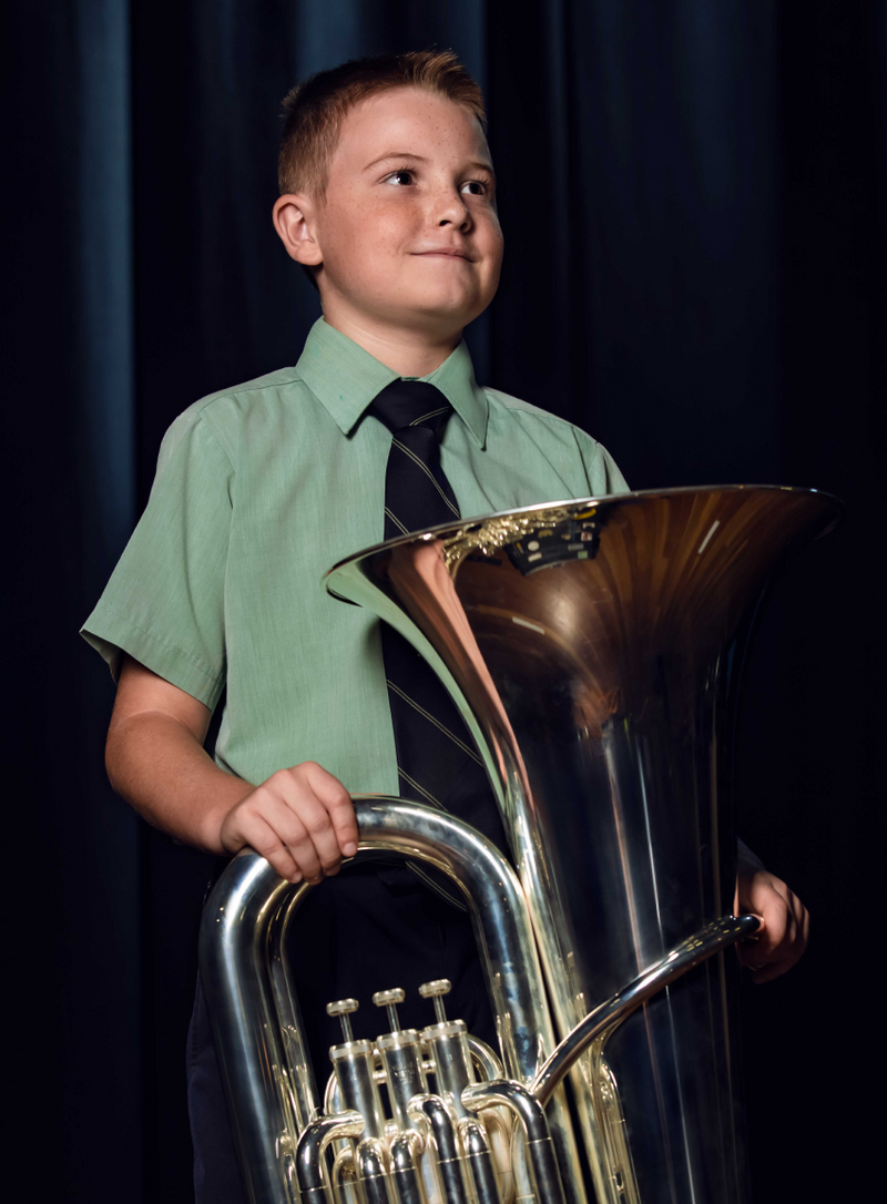 Young student holding Trombone