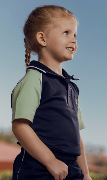 Primary student smiling at others