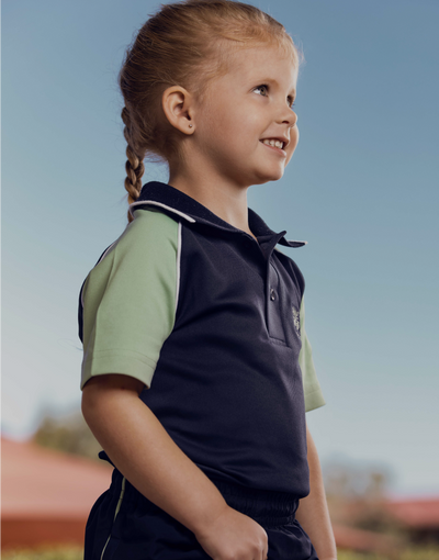 Primary student smiling at others