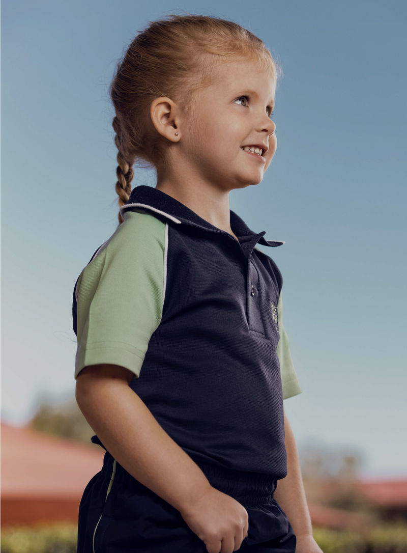 Primary student smiling at others