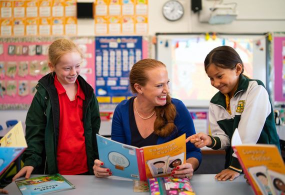 teacher and students reading