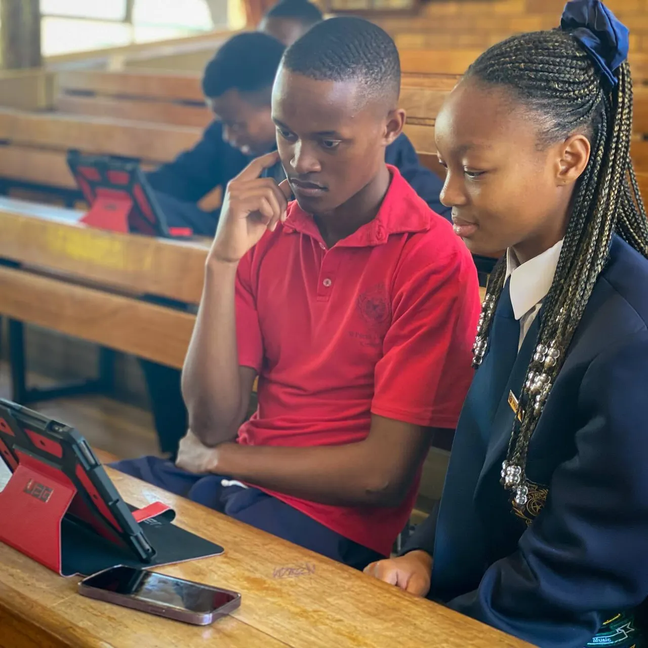Students of St Patricks Kimberley watching an tablet.