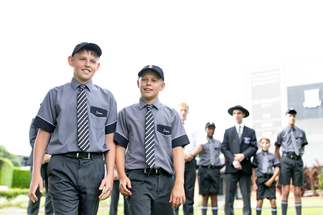 Groups of Iona students with two in-focus close to camera walking together