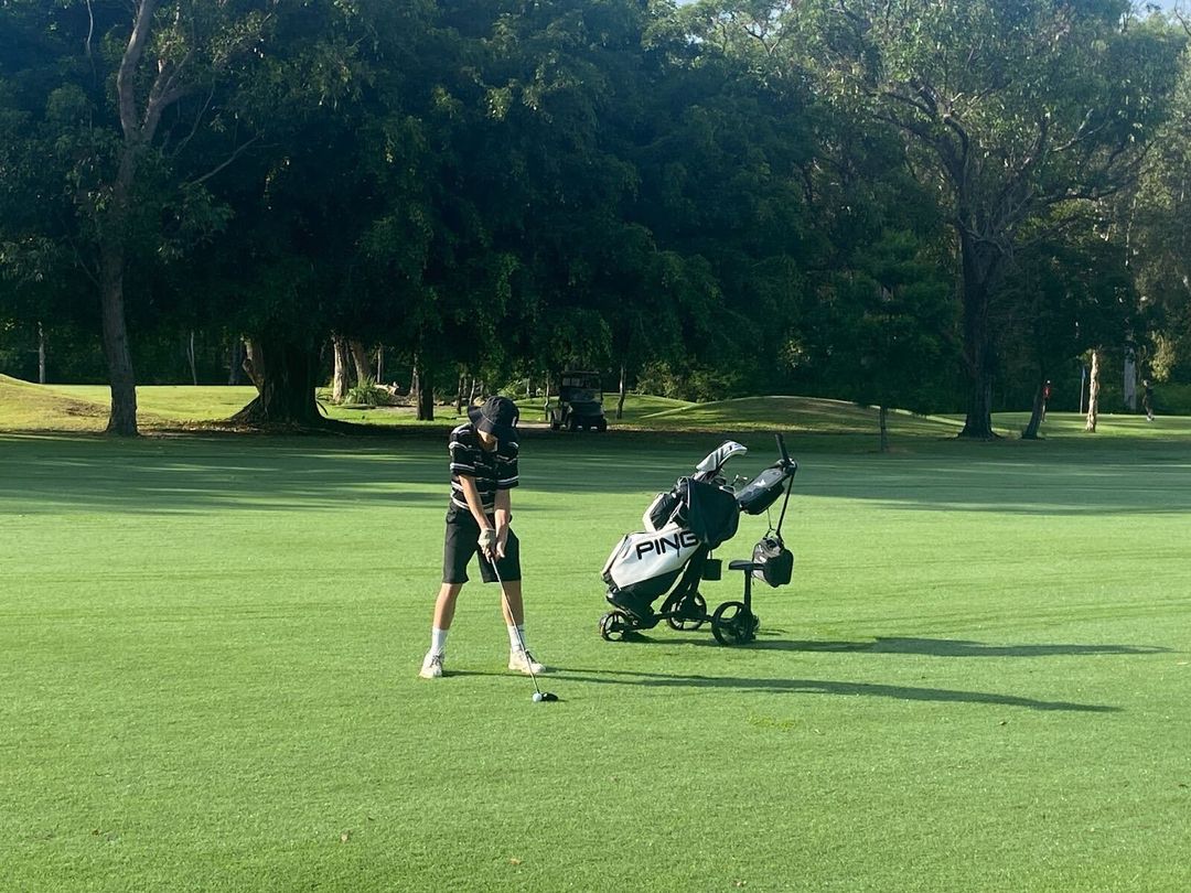 Student playing golf