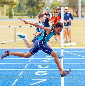 Boy Sprinting Over Line