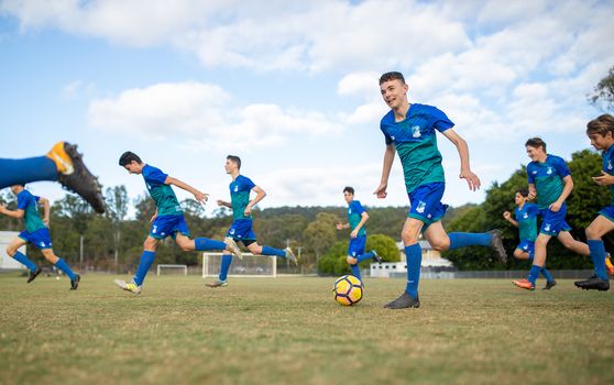 Students Playing Soccer At Kings