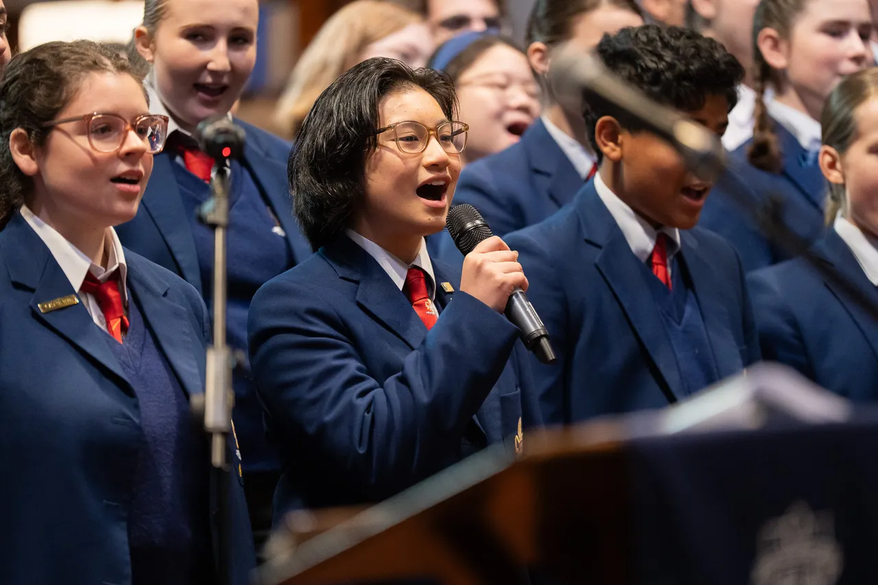 A group of upper secondary school-aged students singing in the Senior School Choir as part of the Overnewton Anglican Community College 2025 Founders' Day Service at our home church, St Paul's Cathedral.