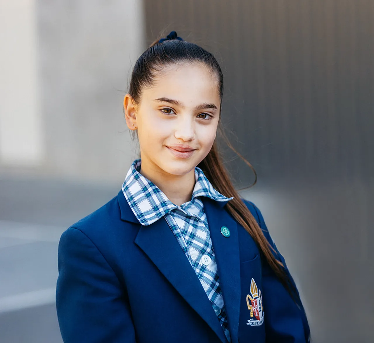 Upper Primary aged Middle School student looking to camera