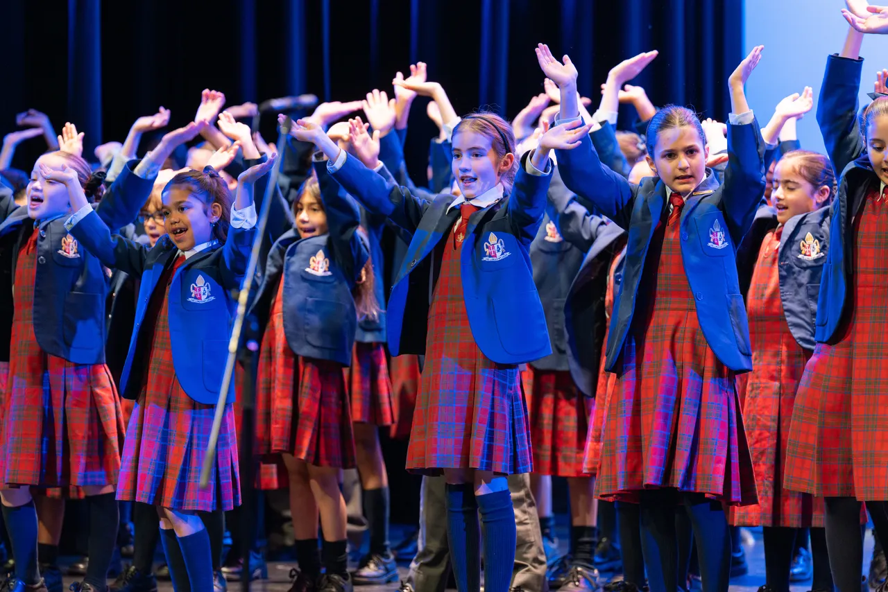 Middle primary school aged Performing Arts students singing as part of the Junior School Choir at Overnewton's Annual Come Together 2026 concert held at the Clocktower Centre, Moonee Ponds.