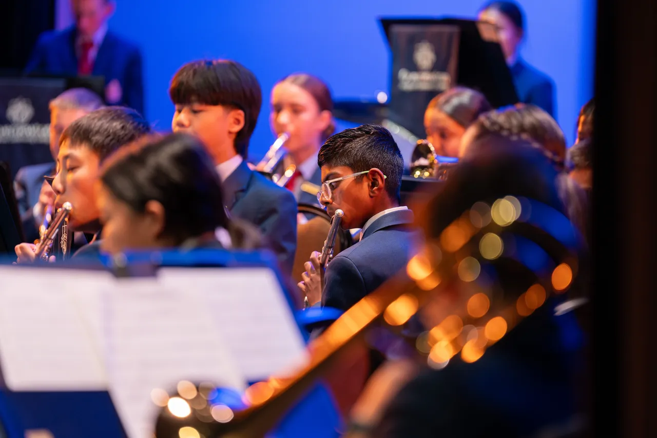 Middle and upper secondary school aged Performing Arts students playing in the Symphonic Band at Overnewton's Annual Come Together 2026 concert held at the Clocktower Centre, Moonee Ponds.