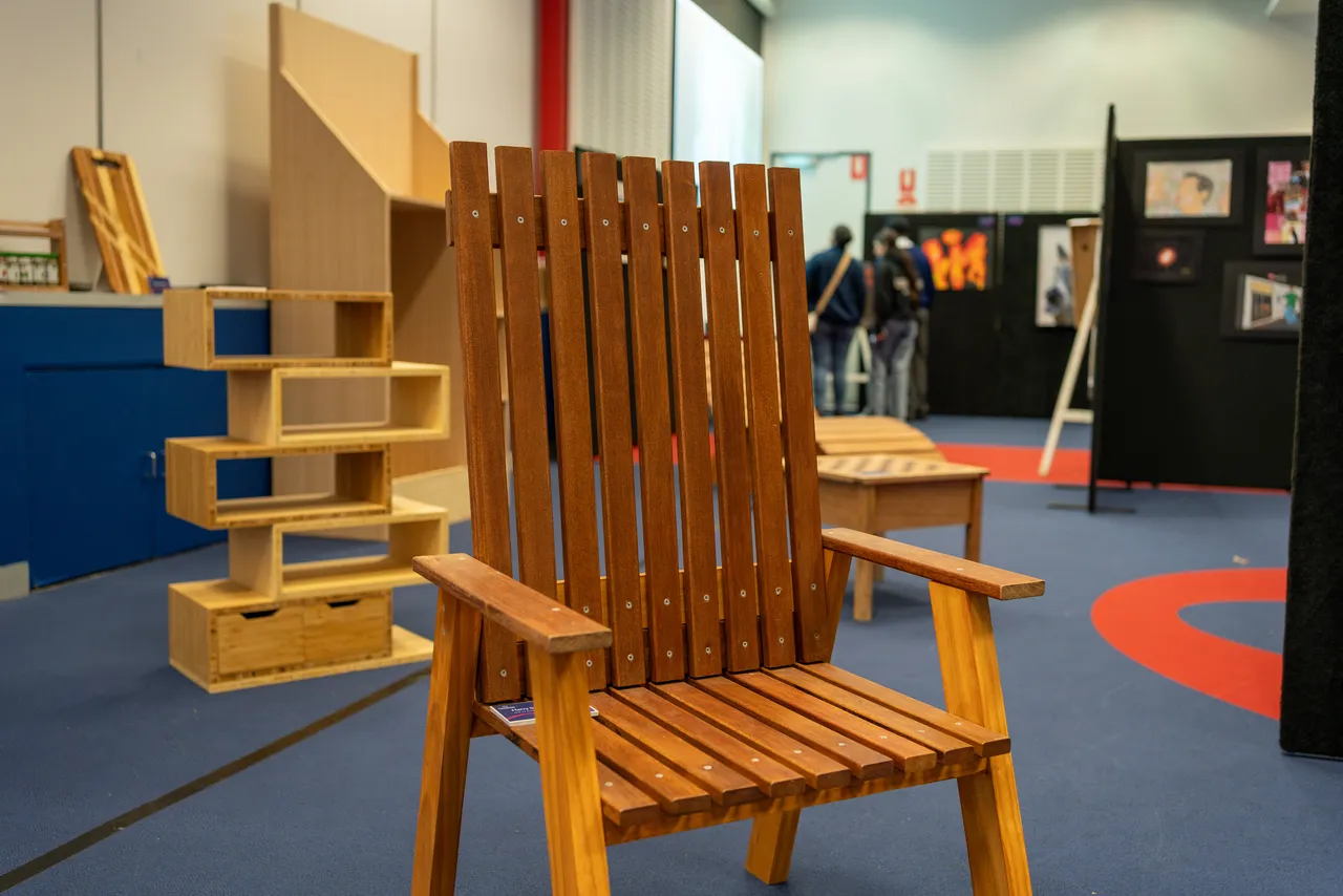 A large wooden deck chair crafted by a Senior School Technologies student on display at Overnewton's Annual Visual Arts & Techologies Exhibition.