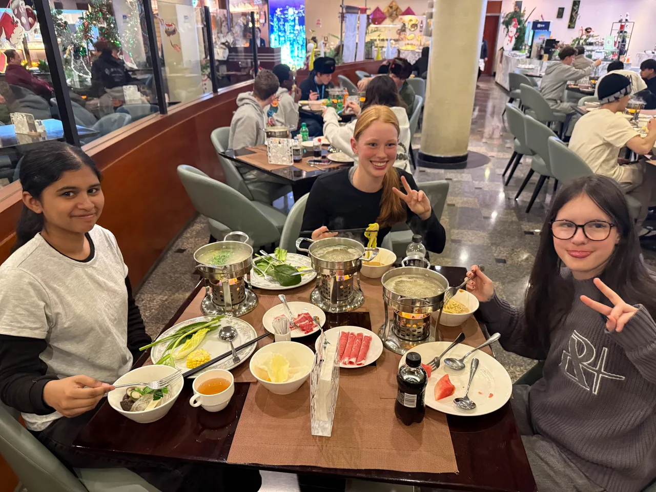 Middle and upper secondary school aged students enjoying a traditional meal in a food court during Overnewton’s 2025 China Tour.