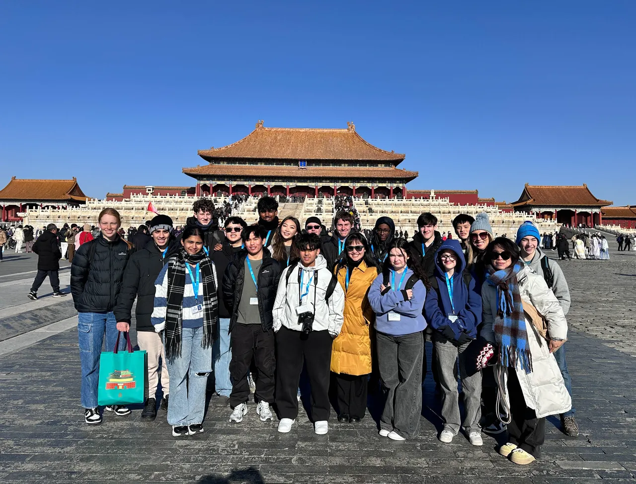 Students and staff standing with a famous temple in the background during a sightseeing tour of Shanghai, as part of Overnewton's 2025 educational travel tour of China.