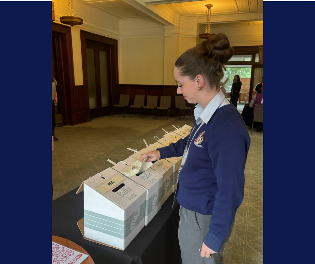 Upper secondary school aged Year 12 student Etienne posting her vote in a ballot at Old Parliament House, as part of the 31st National Schools Constitutional Convention in Canberra.