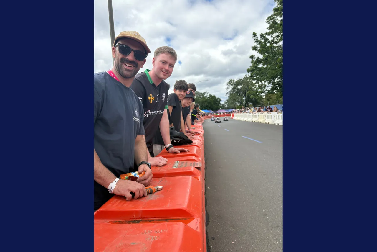 Overnewton teachers smiling trackside, awaiting our Year 9 student teams compete in the Energy Breakthrough Challenge at Maryborough.