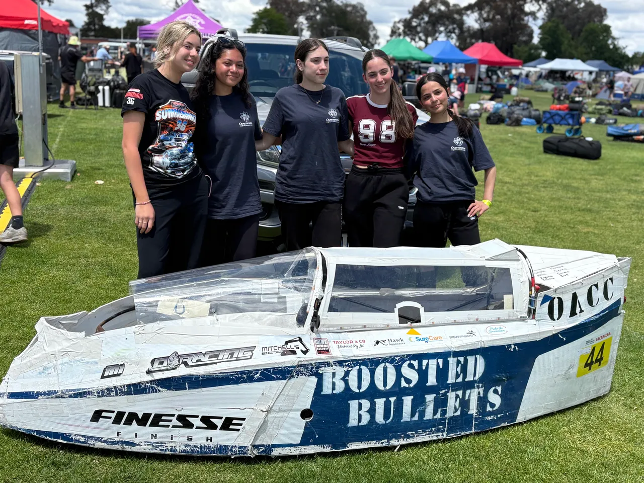 Group of five Year 9 students standing proudly behind the vehicle they built to race at the Energy Breakthrough Challenge in Maryborough.