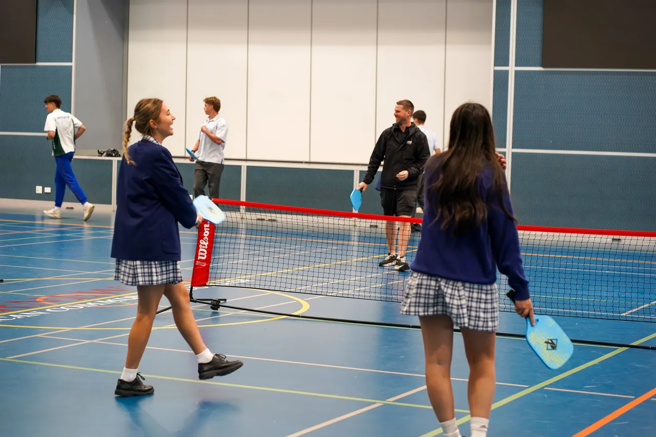 Upper secondary school aged students from Overnewton's Senior School participating in a Staff vs Students Pickleball tournament at Yirramboi Campus to celebrate Health & PE Week.
