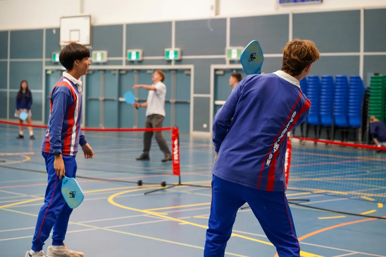Upper secondary school aged students from Overnewton's Senior School participating in a Staff vs Students Pickleball tournament at Yirramboi Campus to celebrate Health & PE Week.