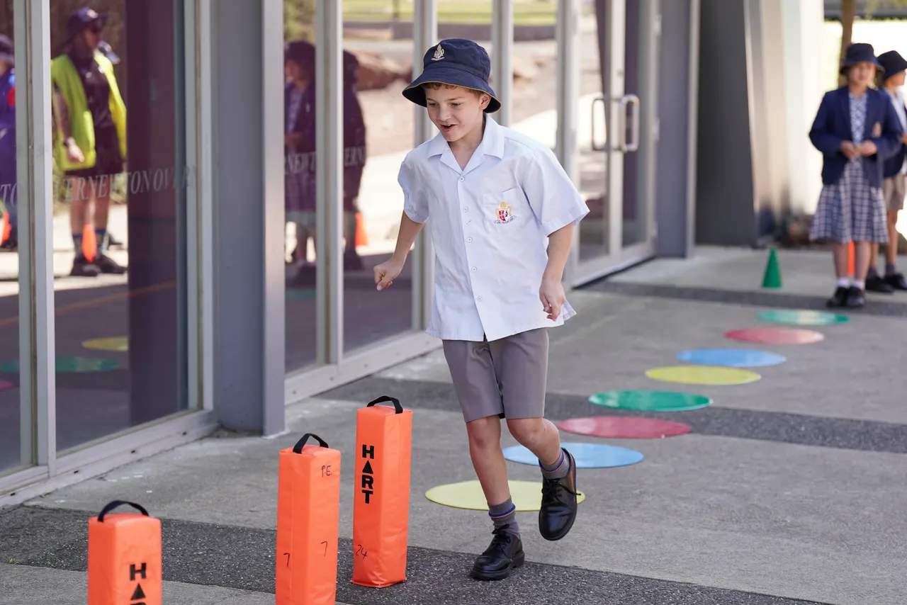 Middle primary school aged student from Overnewton Junior School participating in a sporting activity at Canowindra Campus during House Activate Day.