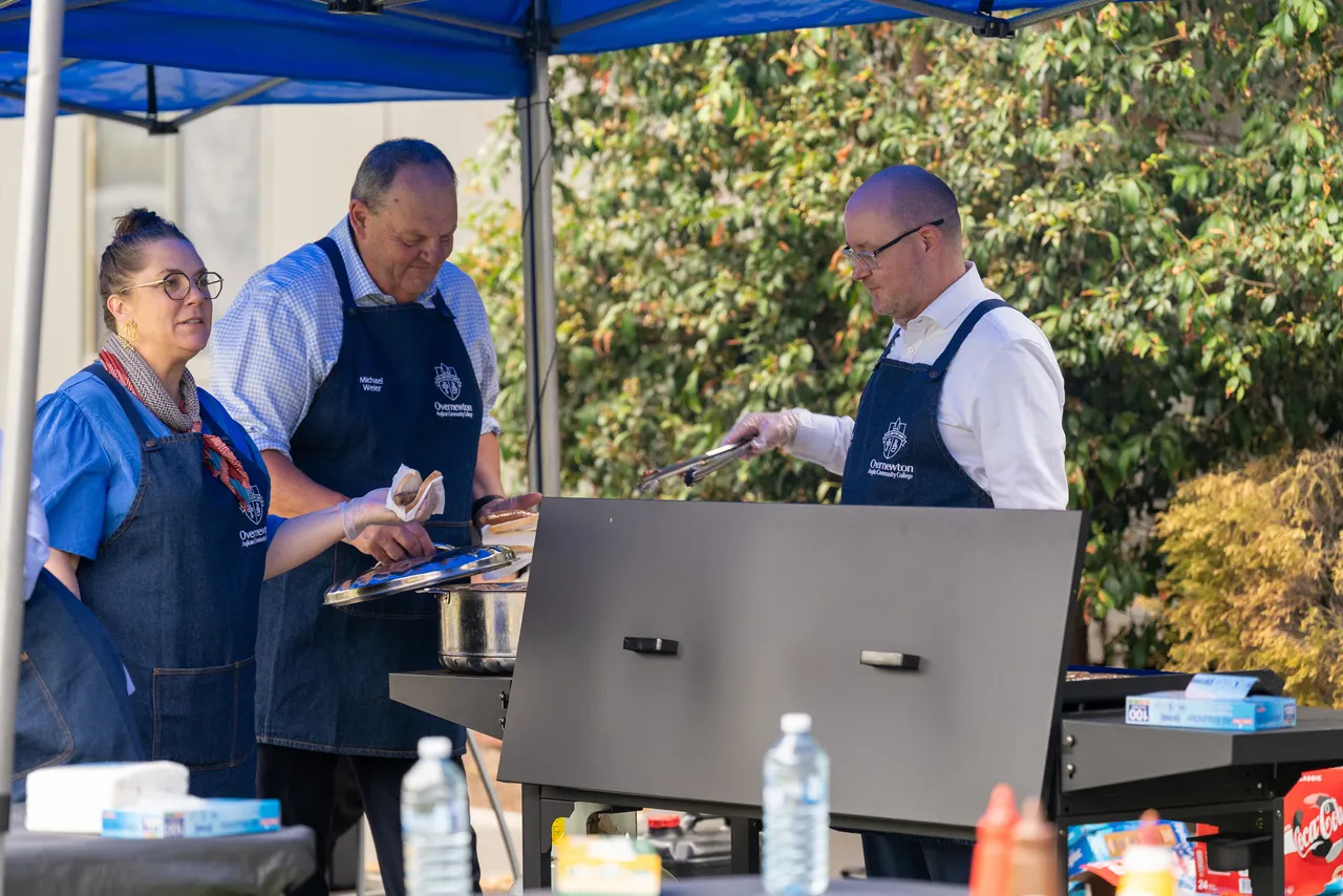 Members of Overnewton College Leadership Team, working at the sausage sizzle as part of the inaugural Canowindra Parent Information Evening.