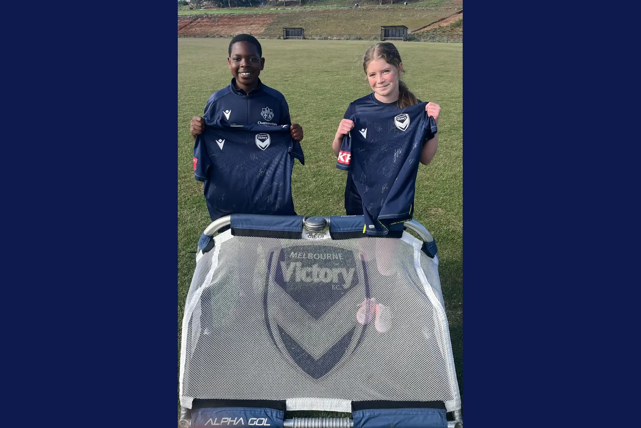 Middle School students from Overnewton holding Melbourne Victory training jerseys presented for their consistency, effort, and development in the 2025 Melbourne Victory Performance Program.