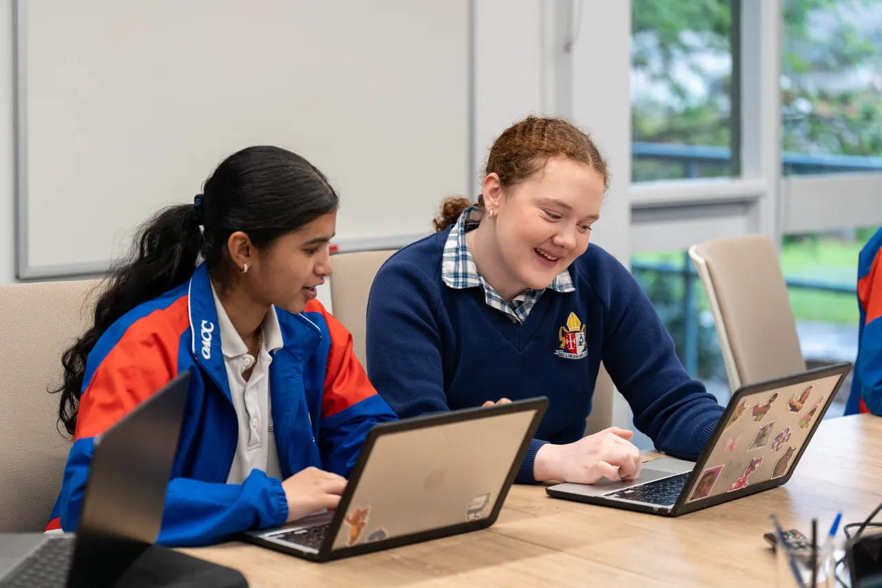 Year 12 Student Executive members working collaboratively using their laptops during a Student Leadership Workshop.